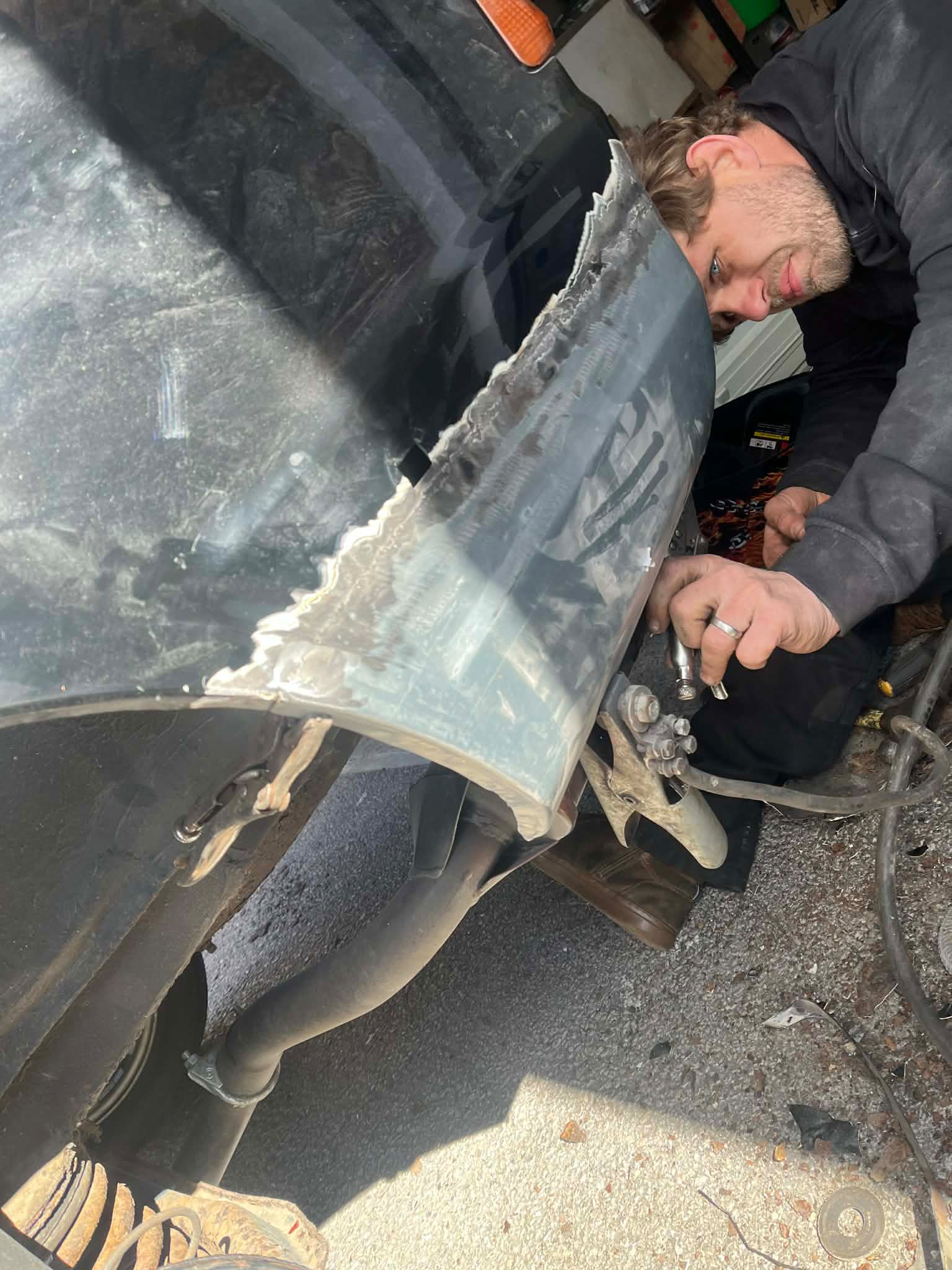 Welder fabricating a replacement body panel